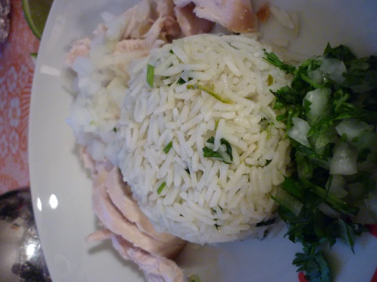 the rice is prepared on a plate with vegetables