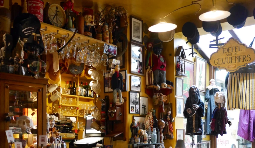 several different shelves with glassware hanging from them