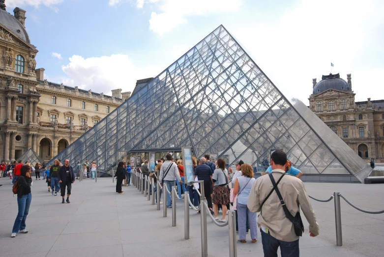 many people walking around an outdoor art gallery