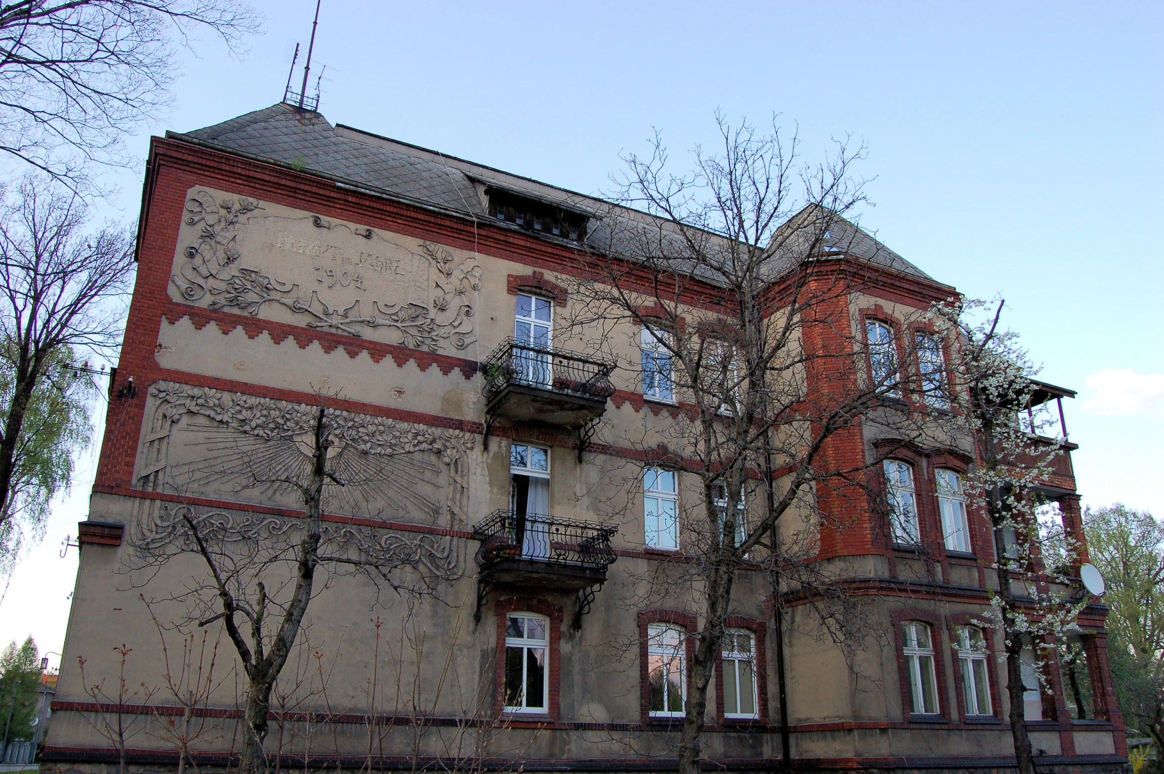 a large brick building sitting on the side of a street