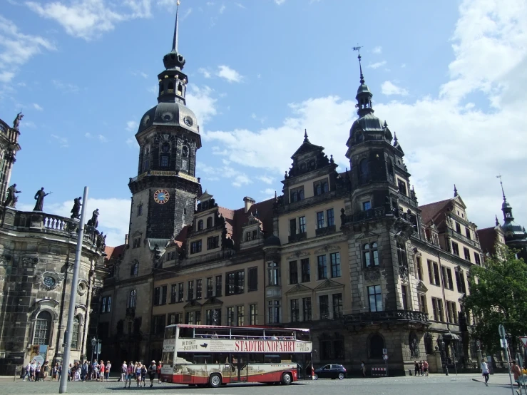 two large buildings sitting next to each other on the side of a street