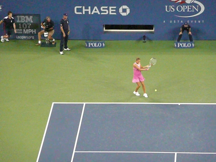 a tennis player is holding her racket ready to play