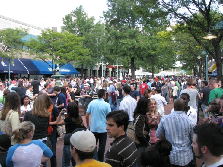 a large group of people are standing in a crowd