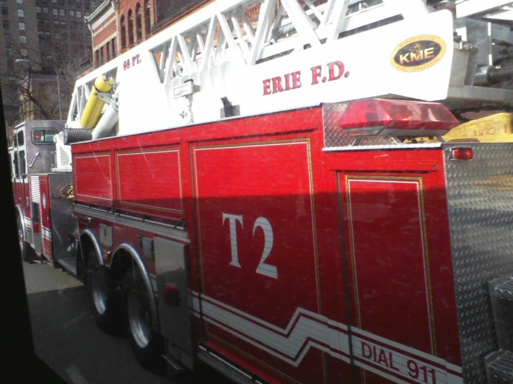 a large fire truck parked by the curb