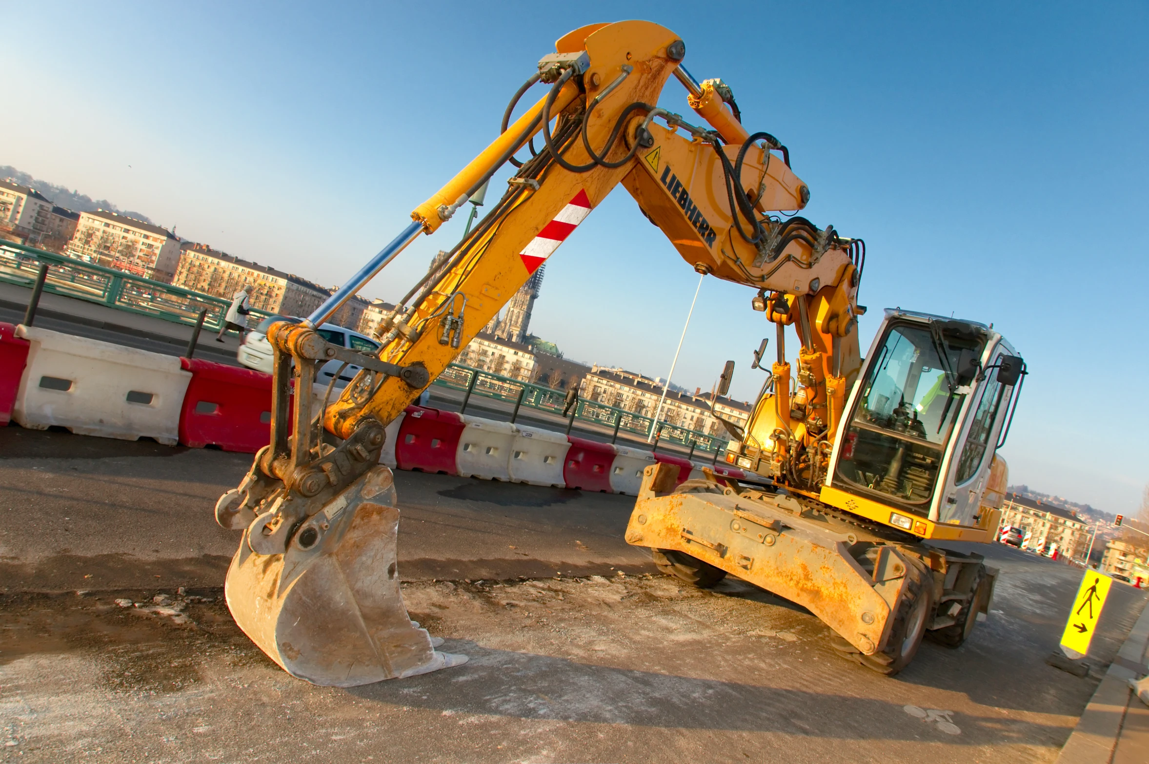 a digger machine is working on a construction site