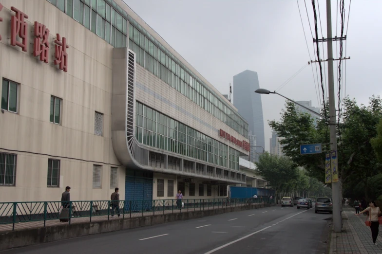 a person is walking by a building and street