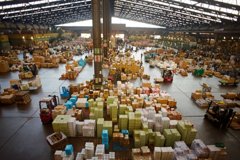 an industrial warehouse filled with boxes and luggage