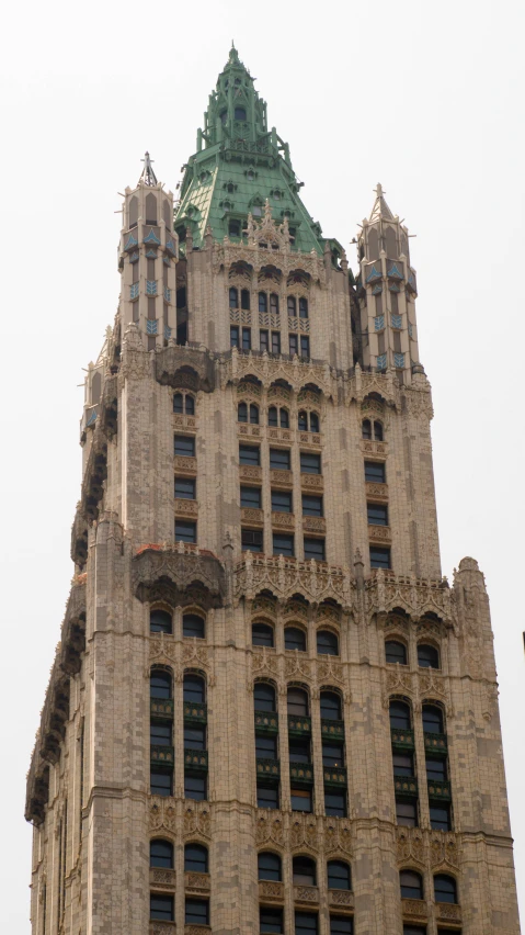 a tall building is shown with a massive clock tower