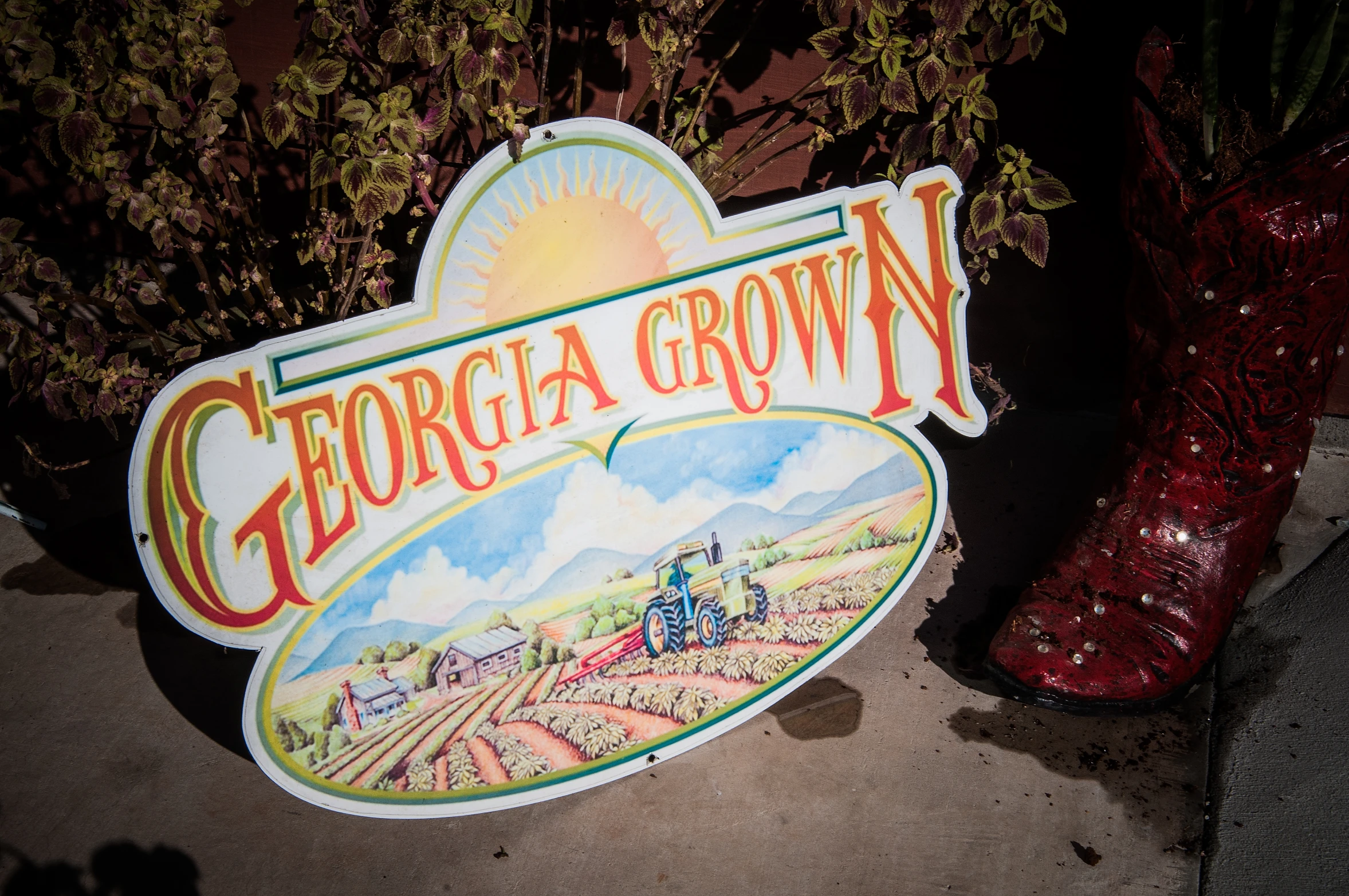 a welcome sign with tractor tractors painted on it