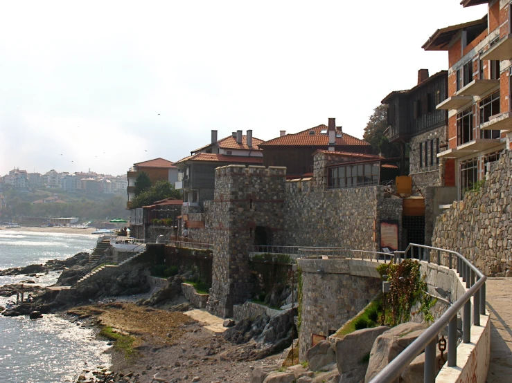 some very pretty stone buildings near the ocean