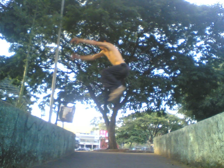 a man jumping up into the air above a skateboard