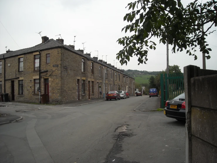 there are many cars parked along this street