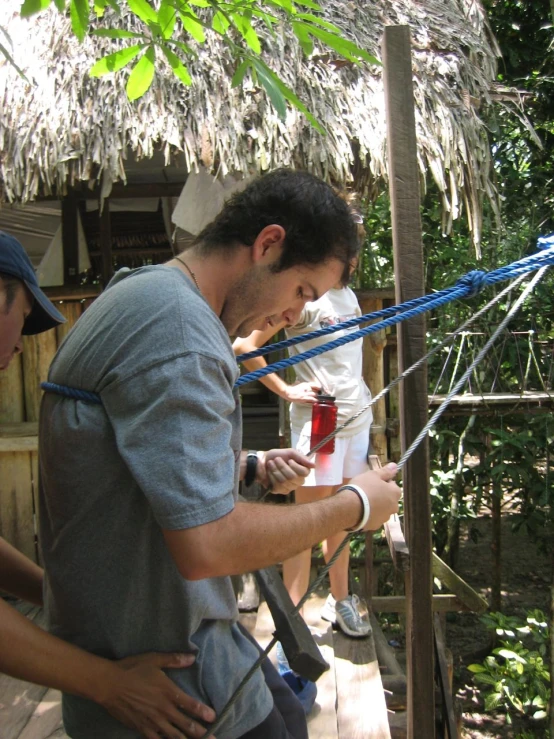 some people and a woman near a tree house