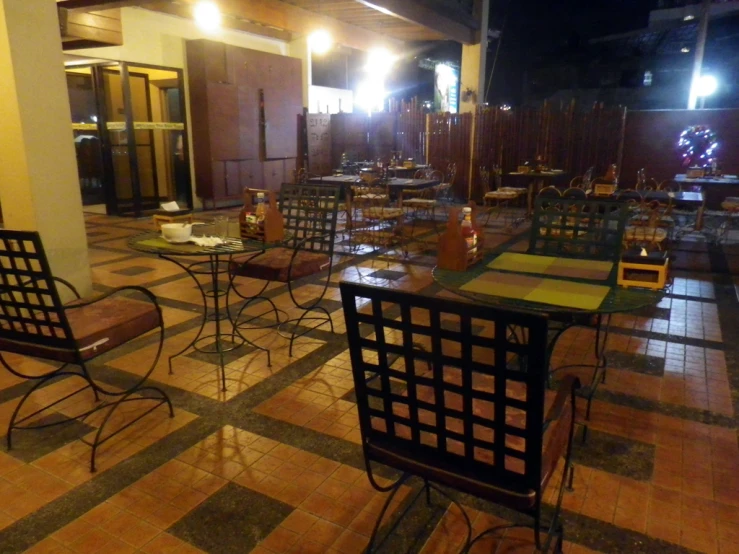tables set up on checkered tiles at a restaurant
