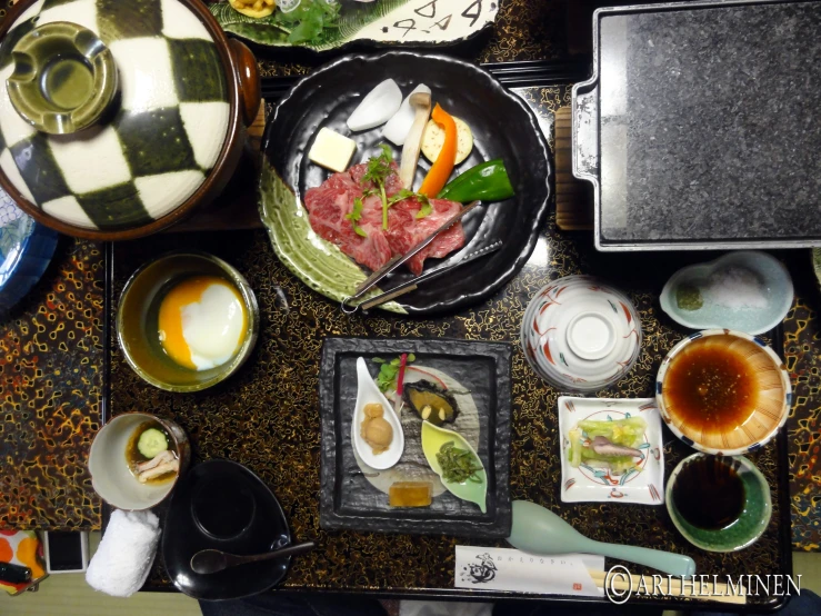 assorted plates, bowls and containers of food