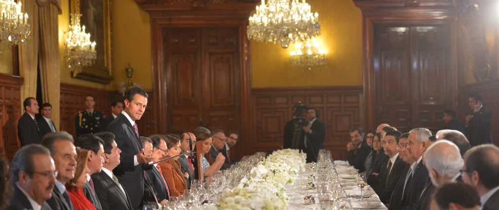 a long table in a formal function with people