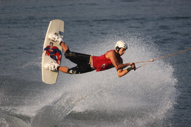 man skiing on the top of waves on board