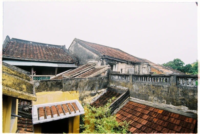 an old building and some buildings with brick chimneys