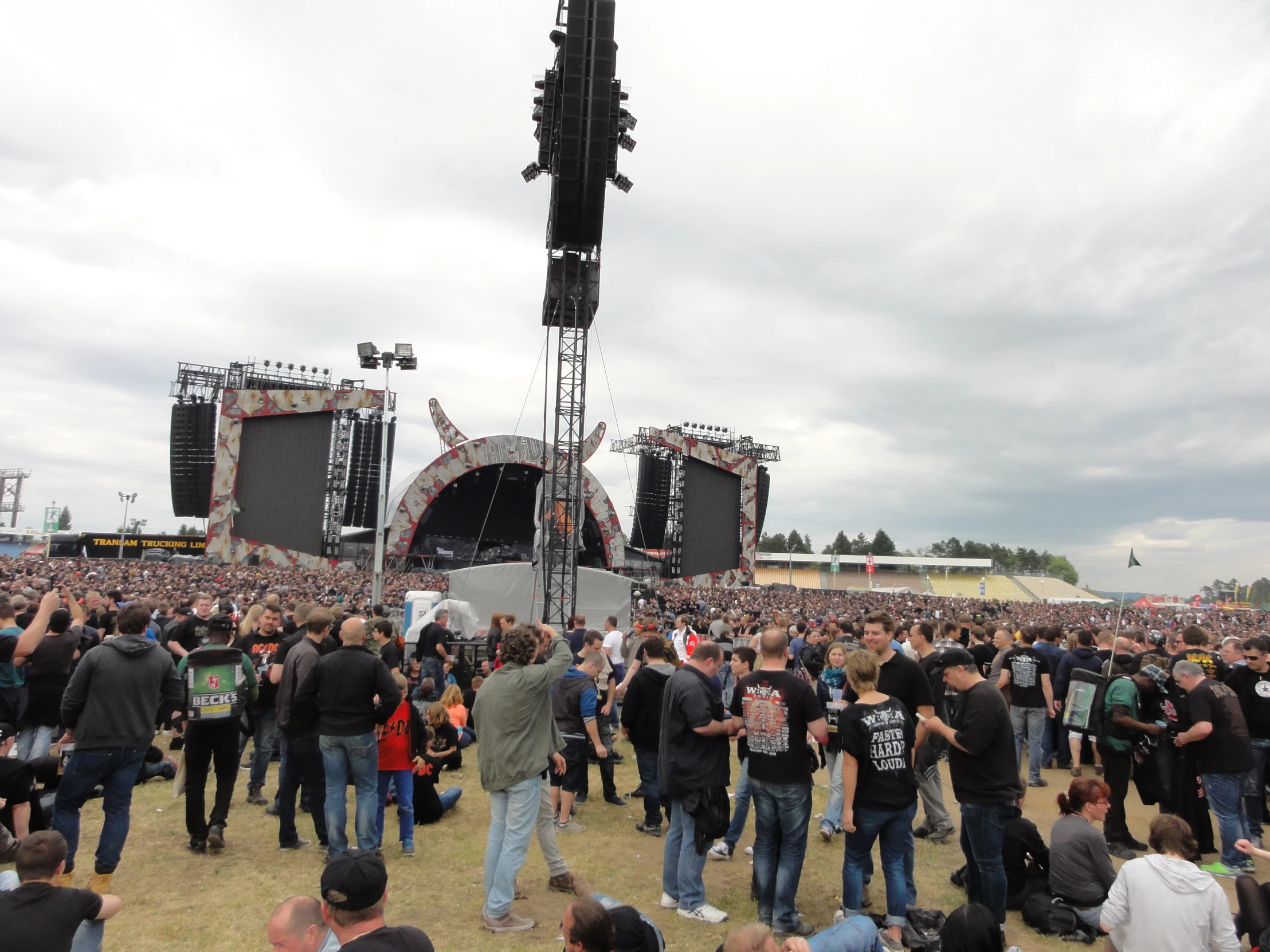 a large crowd is gathered around on stage