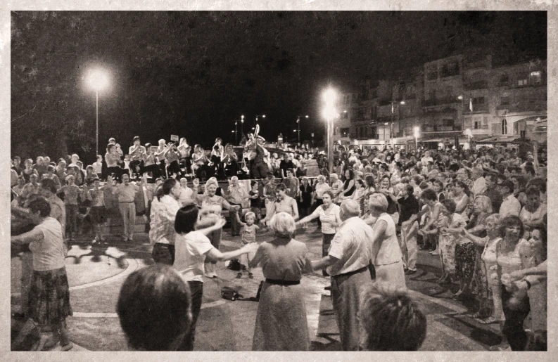 black and white pograph of people at an outdoor concert