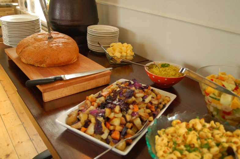 a table is shown with various dishes and food on it