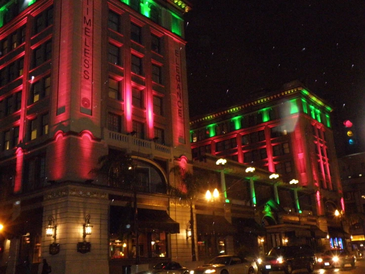 lights on buildings are reflected in street lamps