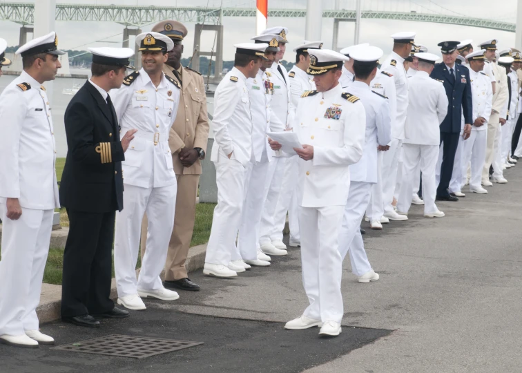 there are many men and women in uniform standing together