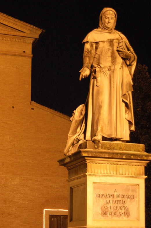 a white statue is in the dark with a black background