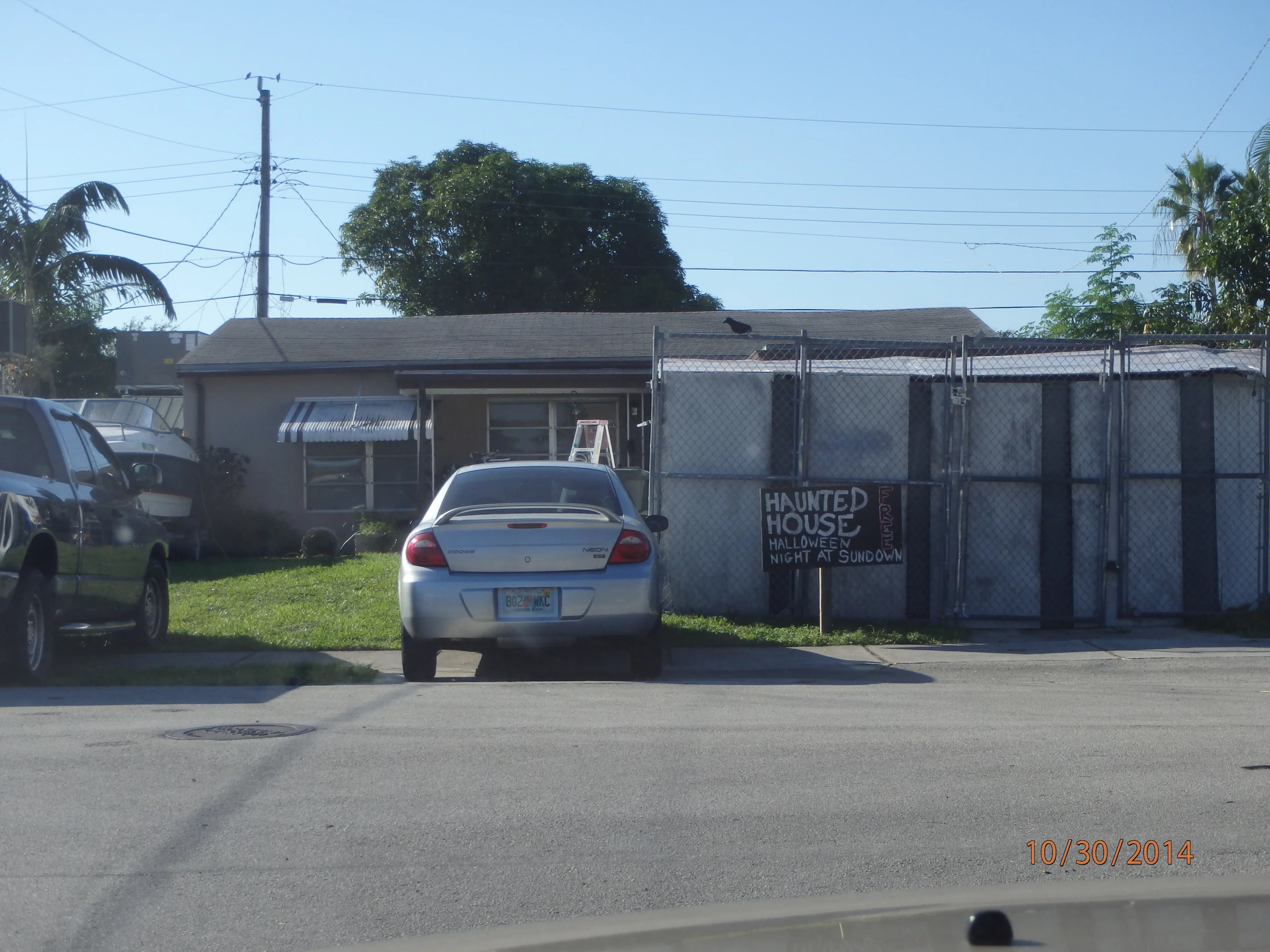 there is a car parked in front of a house