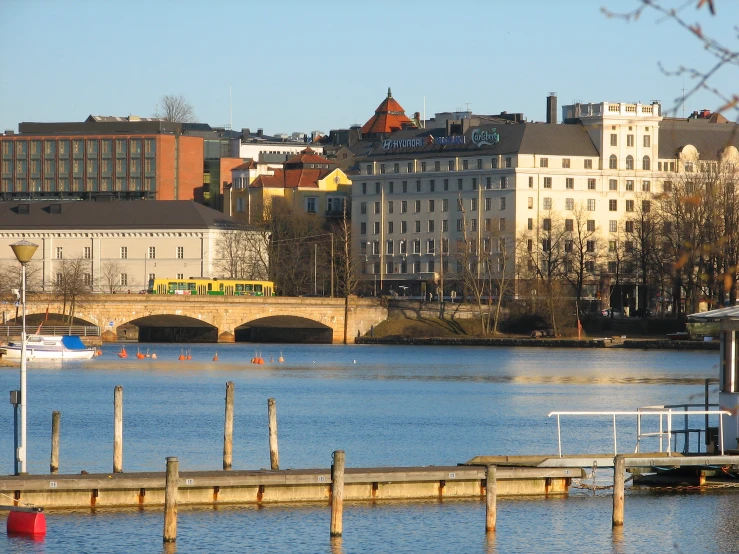 some boats floating on the water near some buildings