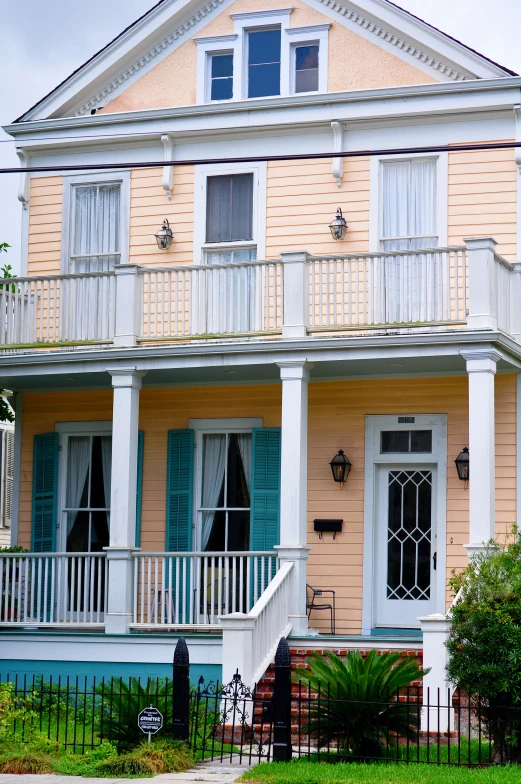 this is a house that has shutters on the front and windows