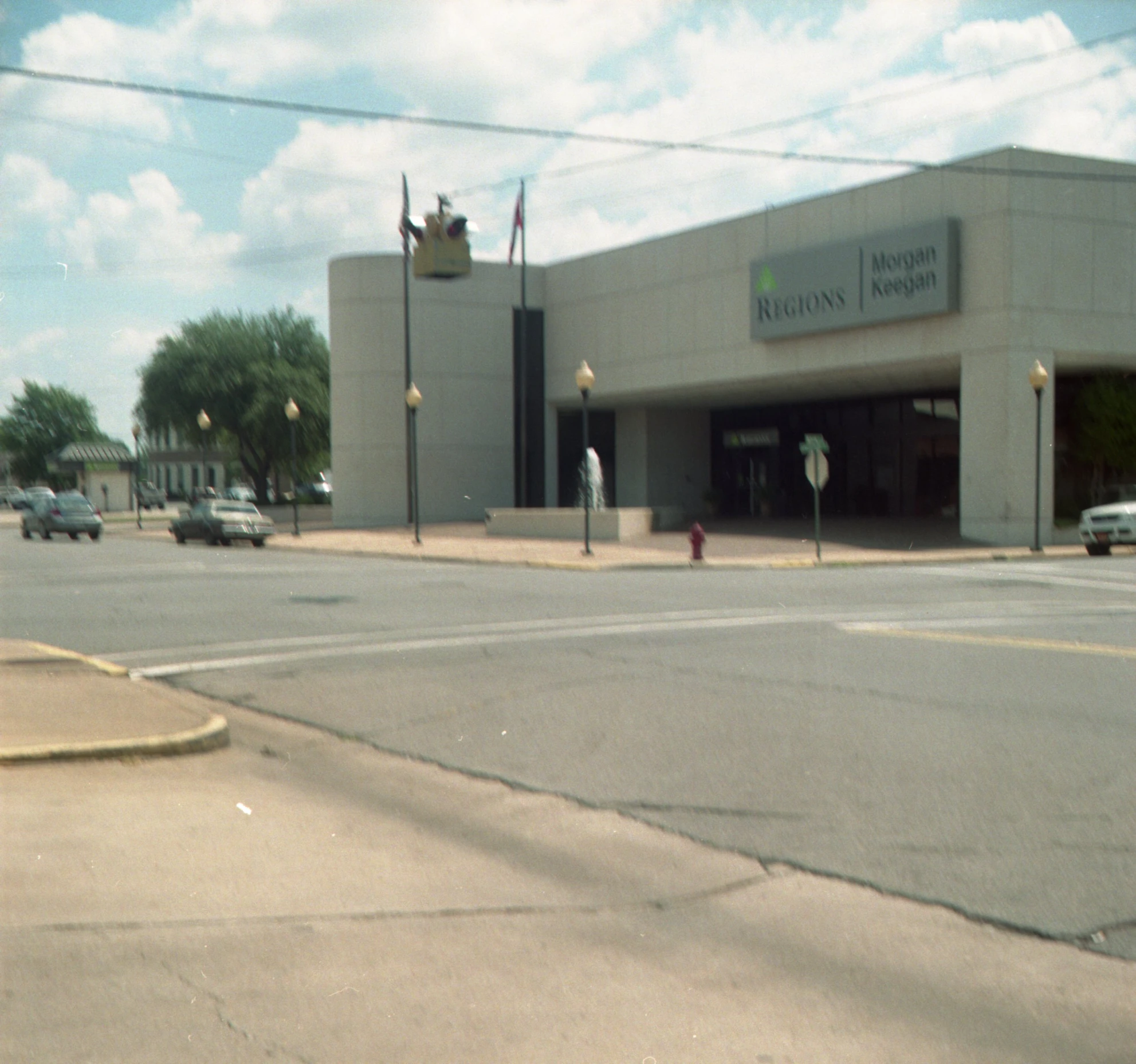 this is a street corner that has a shopping center