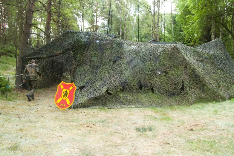 a sculpture of a mountain is covered in plants