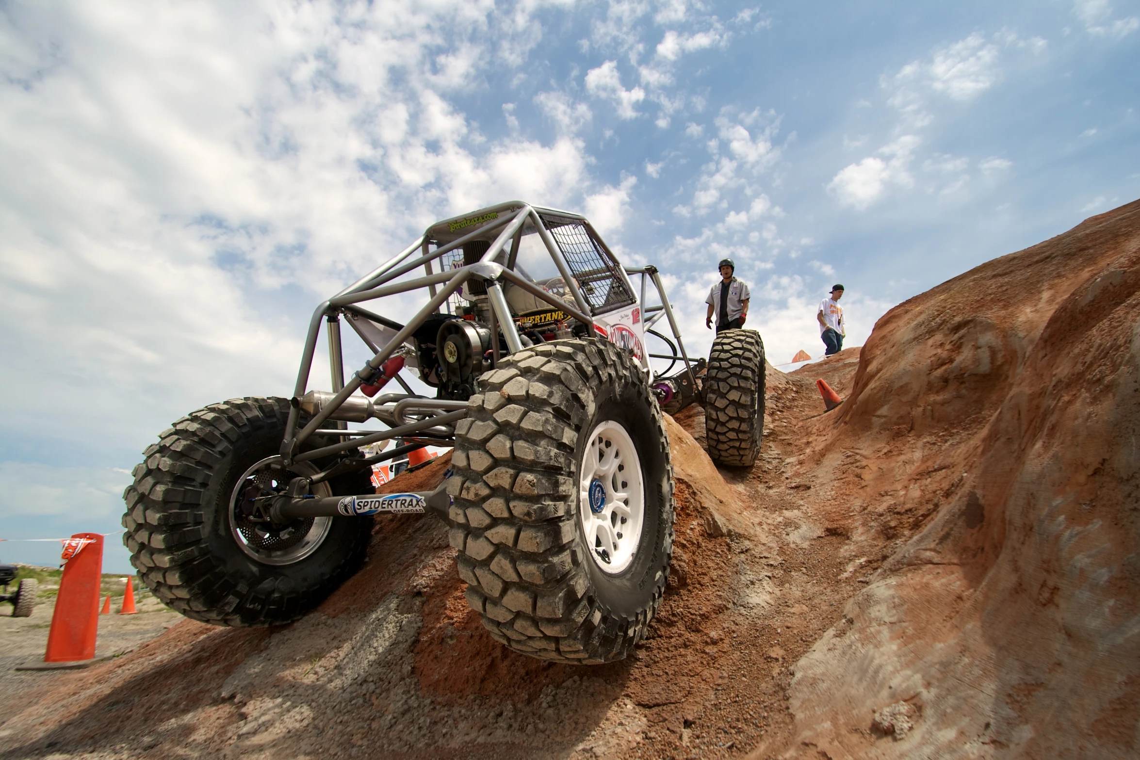 a four - wheeler truck in the mud on a dirt track