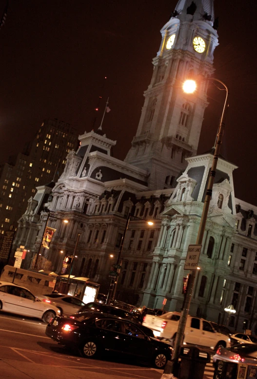 night view of historic city buildings and clock tower