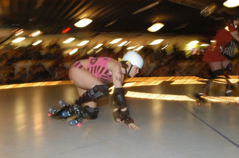 a female roller skater riding through a warehouse