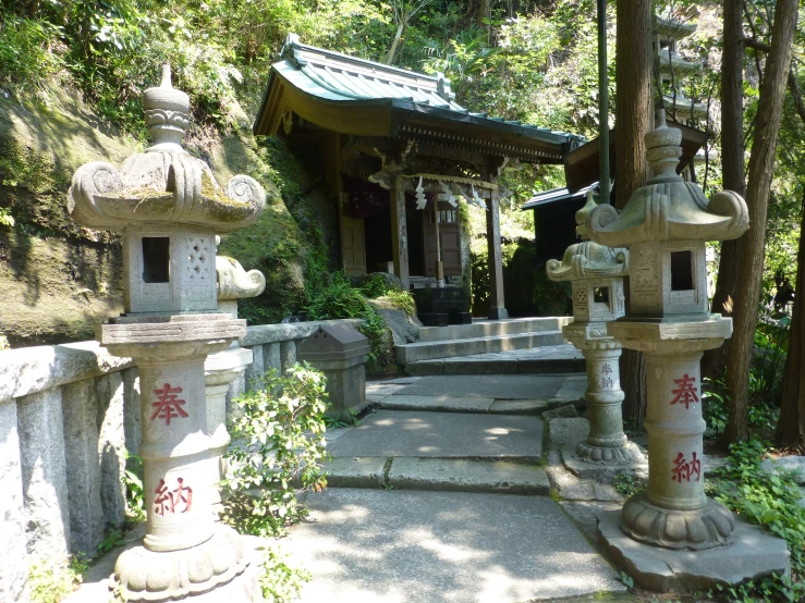 two stone sculptures with chinese writing on them