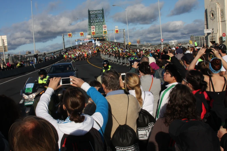 a large crowd of people that are on a street