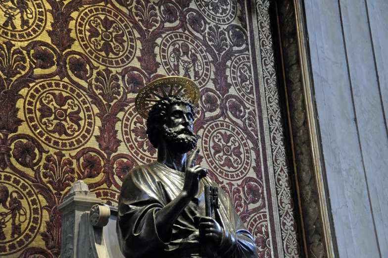 a statue standing with his hands clasped by his hand