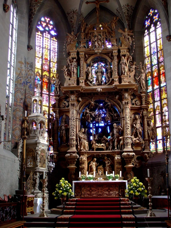 the altar is in front of a stained glass window