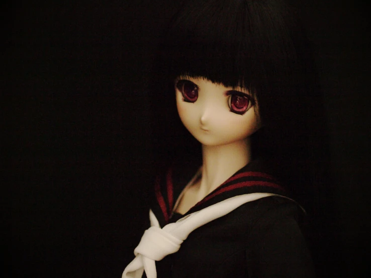 a dark doll has a white neck tie