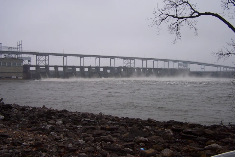 a dam with water gushing out of the side