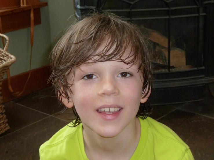 a child with wet hair looks into the camera