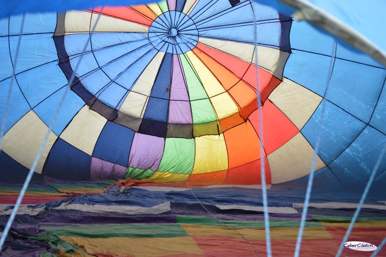 several large colorful balloons floating in the air