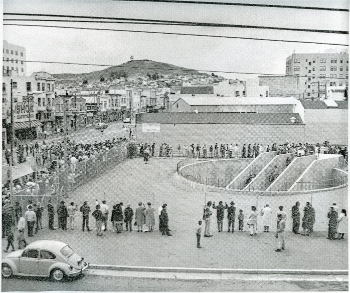 an old black and white po of people walking