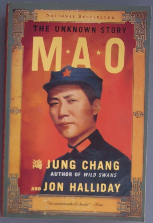 a chinese poster with mao on the cover