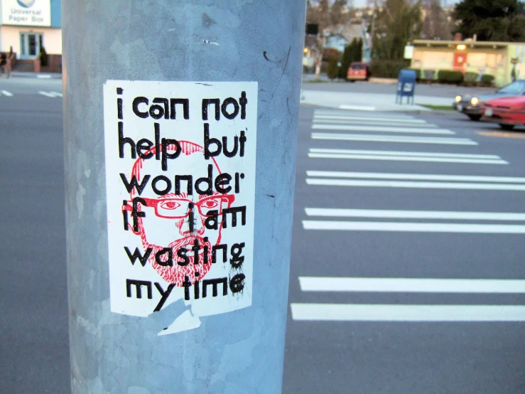 a parking meter with sticker that says, i can not help but wonder if my writing is my time