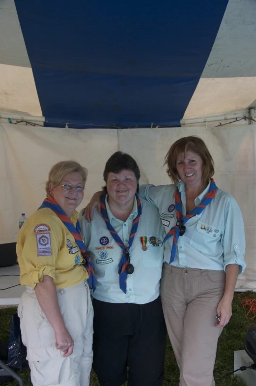 three women who are standing next to each other