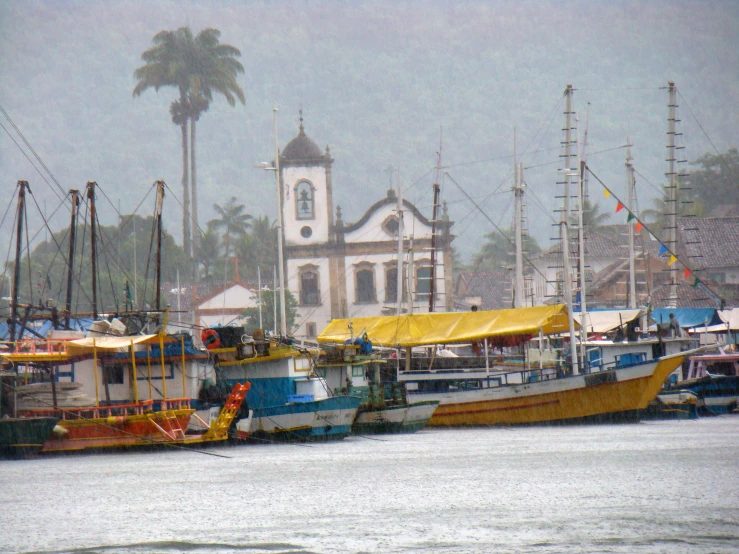 various boats in the water near buildings