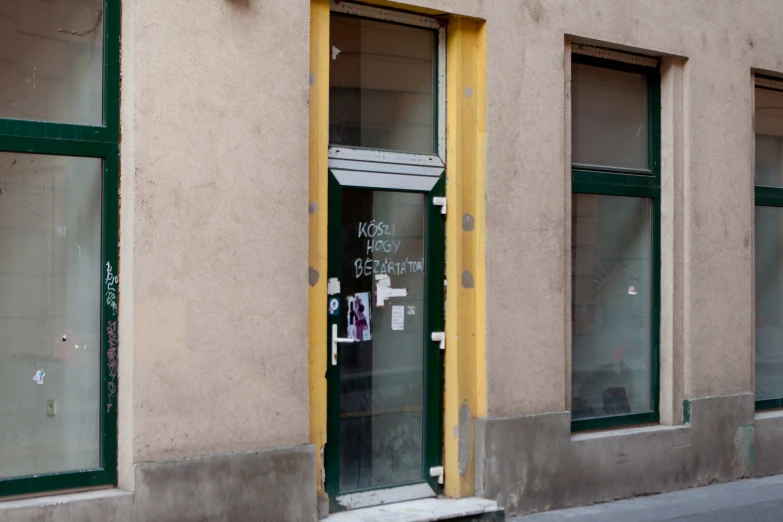 a building has been boarded down and the door was open